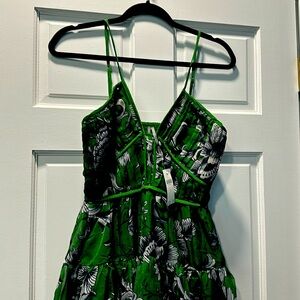 The dress fits like a size 6. It is beautiful for a summer function.